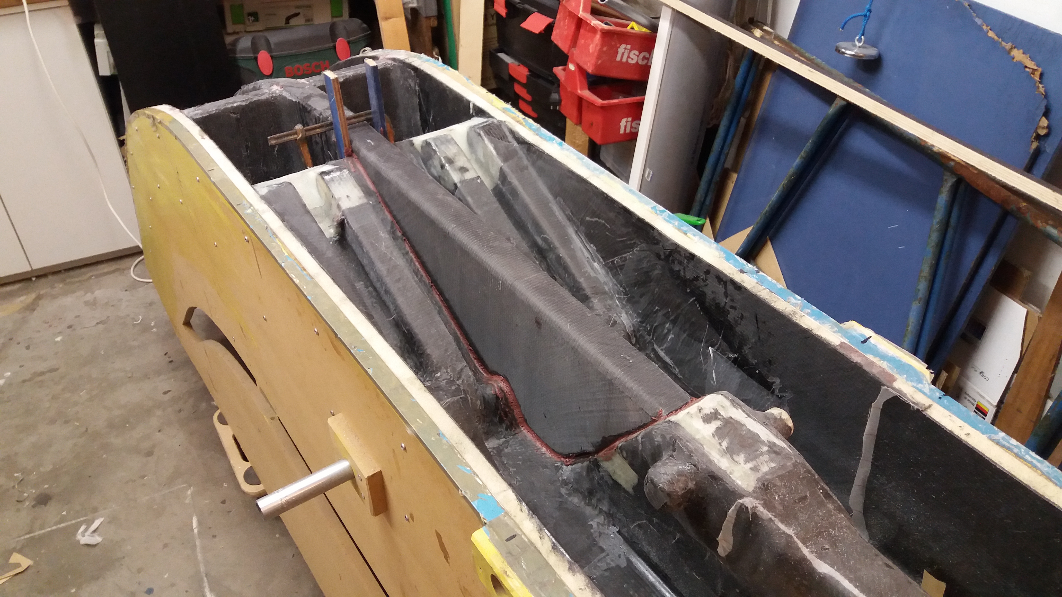 Lower folding strut beam anchor assembly installed in the beam.