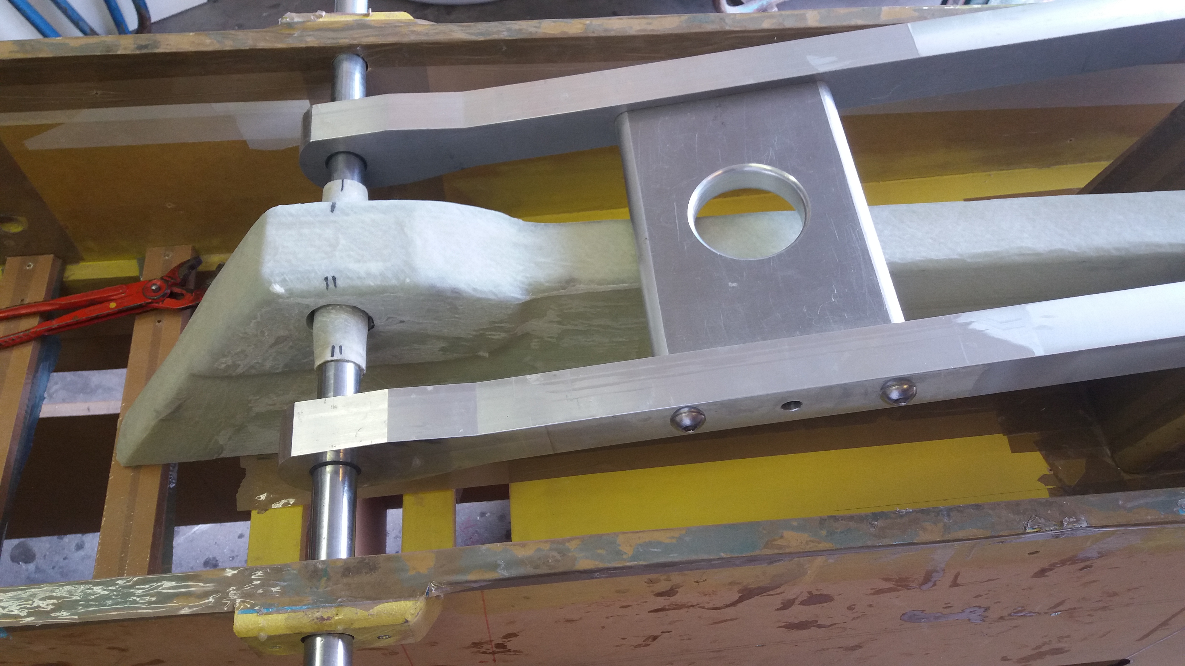 Upper folding strut recess molding temporarily installed and aligned in the beam using the lower folding strut.