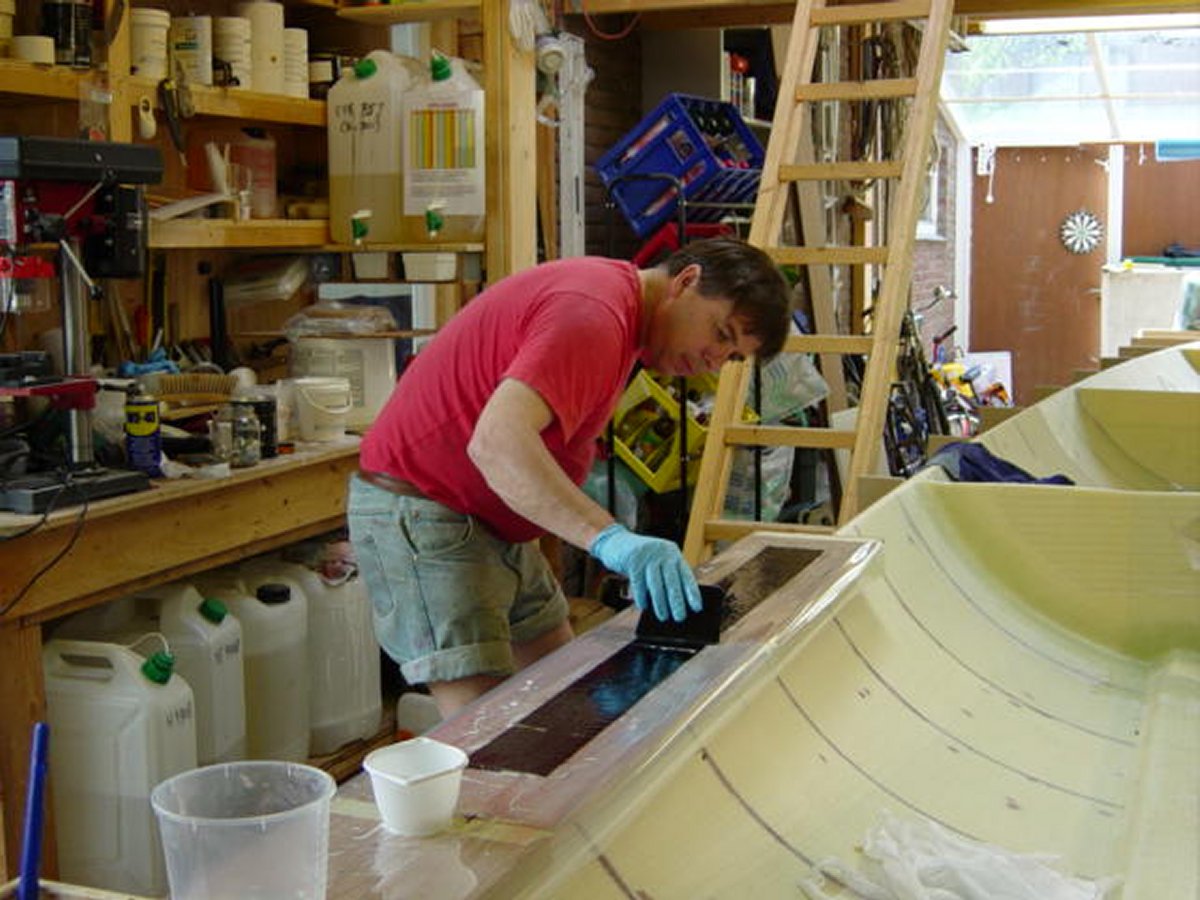 Carbon fiber chainplate with stainless thimble, built from a high-density foam core and UD carbon, prepared for a Precourt deadeye.