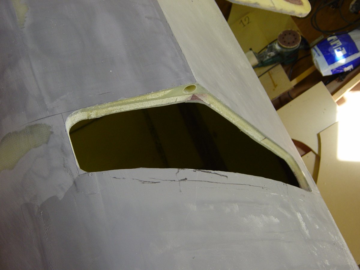 Large openings cut into the raised deck area of the float to accommodate wider beams in the final F-39 design.