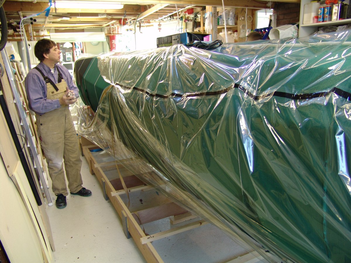 Vacuum infusion of the complete external laminate of the port float in a single shot.