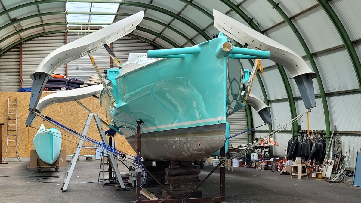 Fram inside the shed with floats removed and the beams opened wide to create space for deck painting
