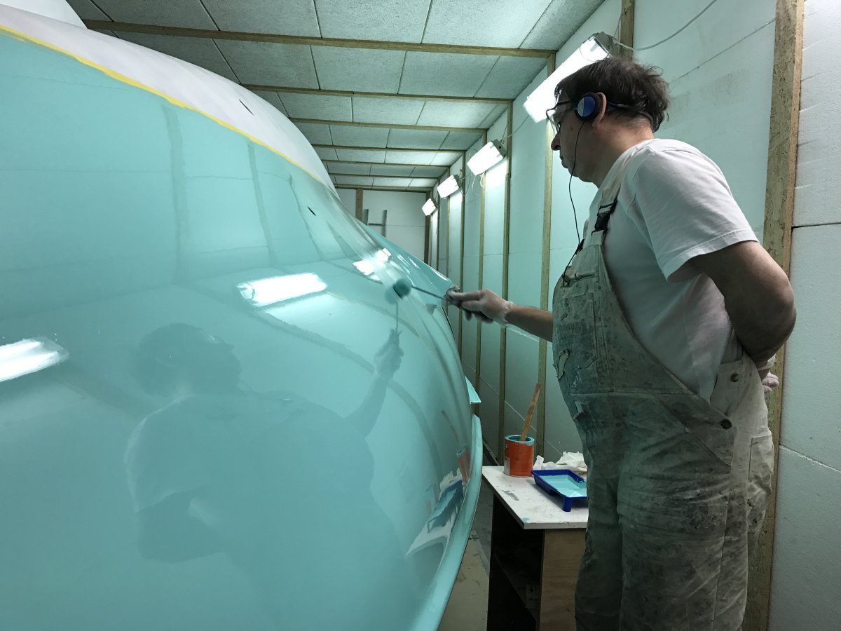 Main hull fairing and painting: long-knife fairing, high-build primer, and Mint Green topcoat