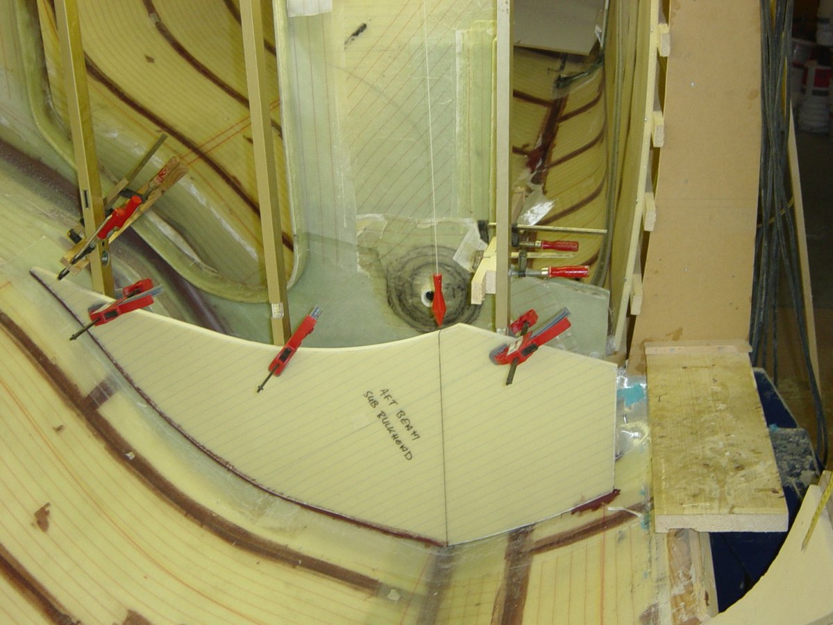 Structural sub-beam bulkheads and interior details completed in the port side half of the main hull